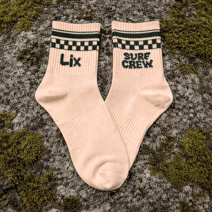 Bas beige en nylon avec surf crew vert foret. 